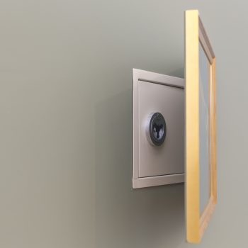 Wall safe hidden behind a painting